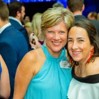 Friends smiling together in the Laker Lounge